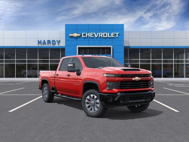 2026 Chevrolet Silverado 2500 HD Custom in Red Hot — front three-quarter view