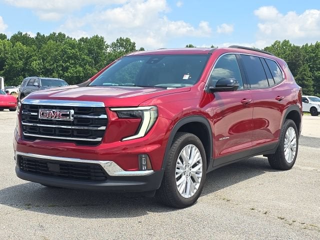 2024 GMC Acadia Elevation in Volcanic Red Tintcoat — front three-quarter view