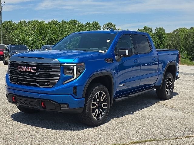 2023 GMC Sierra 1500 AT4 in Dynamic Blue Metallic — front three-quarter view