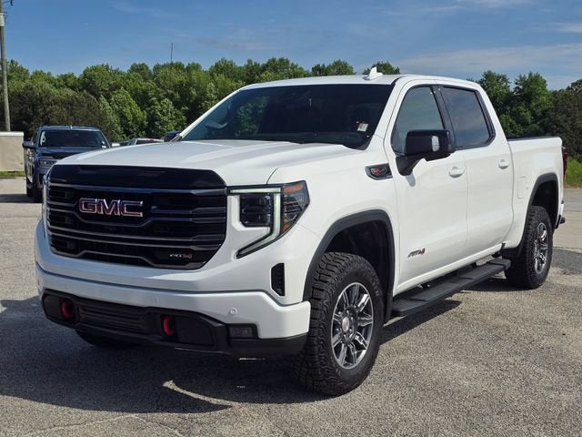 2025 GMC Sierra 1500 AT4 in Summit White — front three-quarter view
