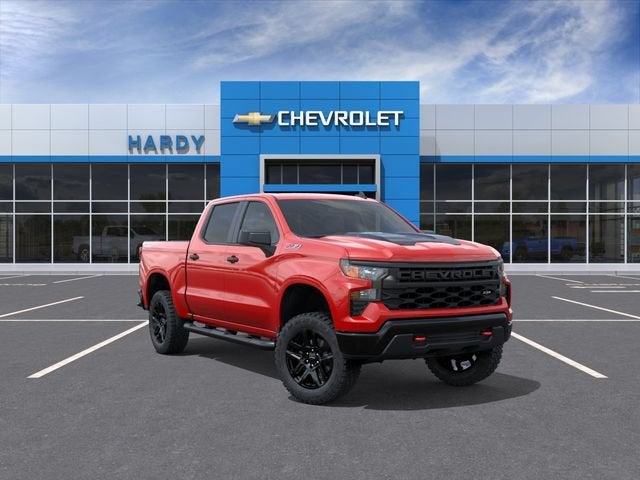 2026 Chevrolet Silverado 1500 Custom Trail Boss in Red Hot — front three-quarter view