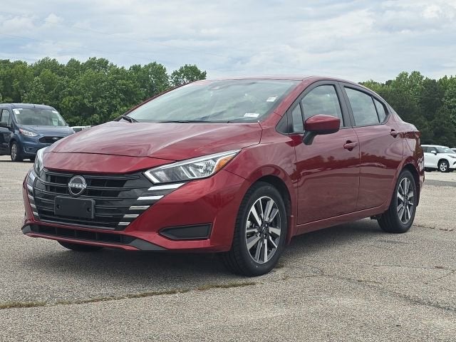 2024 Nissan Versa 1.6 SV in Red — front three-quarter view