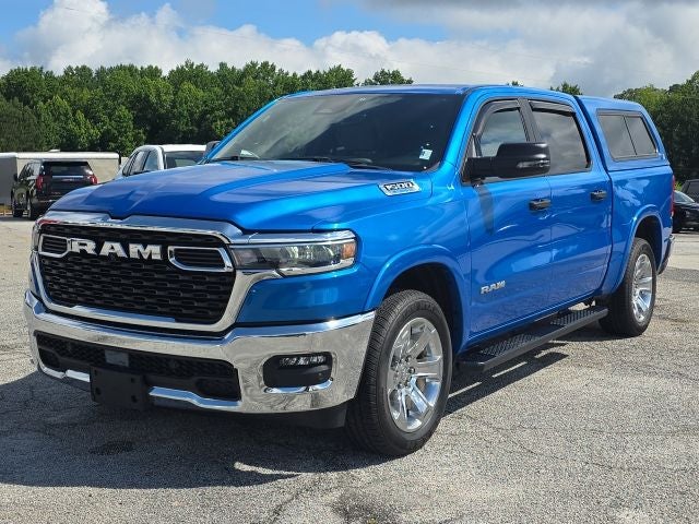 2025 RAM 1500 Big Horn/Lone Star in Hydro Blue Pearlcoat — front three-quarter view