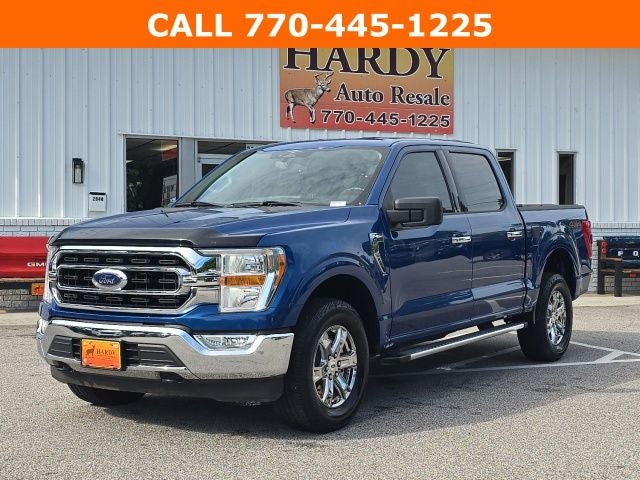 2023 Ford F-150 XLT in Blue Metallic — front three-quarter view