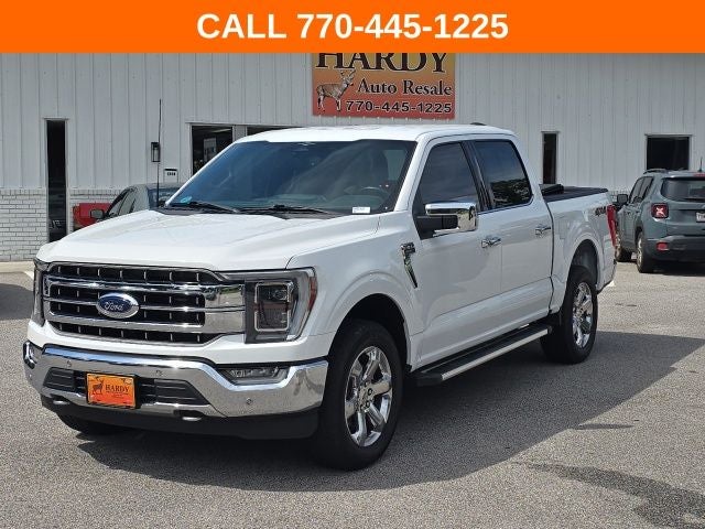 2023 Ford F-150 Lariat in Oxford White — front three-quarter view