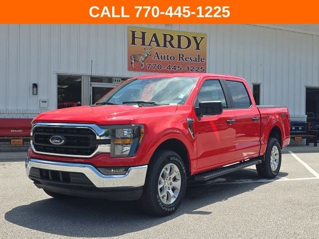 2023 Ford F-150 XLT in Race Red — front three-quarter view
