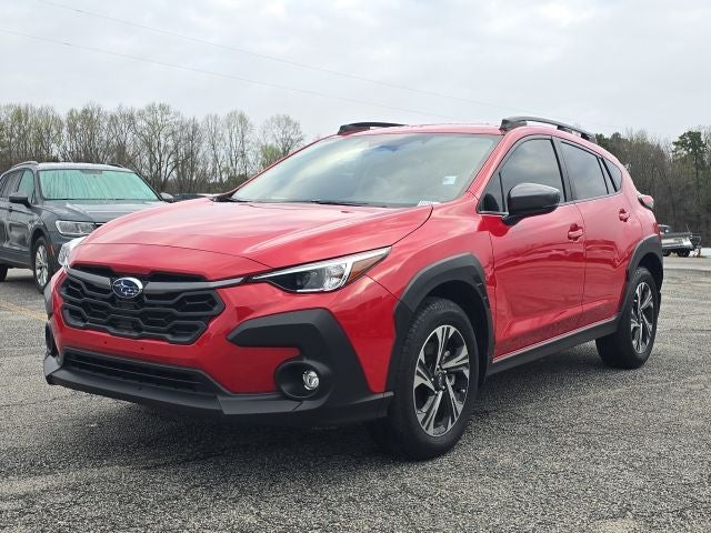 2024 Subaru Crosstrek Premium in Pure Red — front three-quarter view